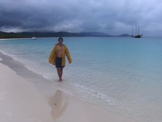 A short downpour made us giggle in sacks and jackets at the most beautiful beach in the world